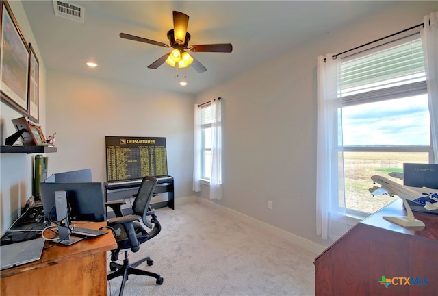 carpeted office with ceiling fan