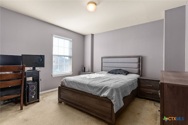 bedroom with light carpet