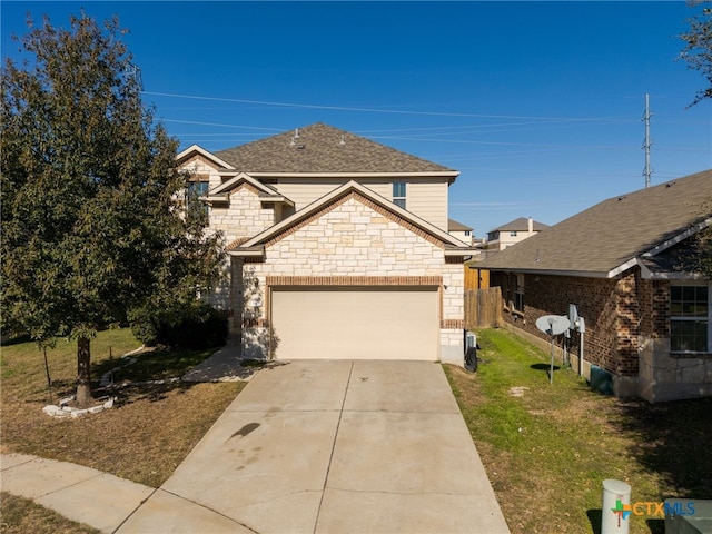 view of front of home featuring a garage and a front lawn