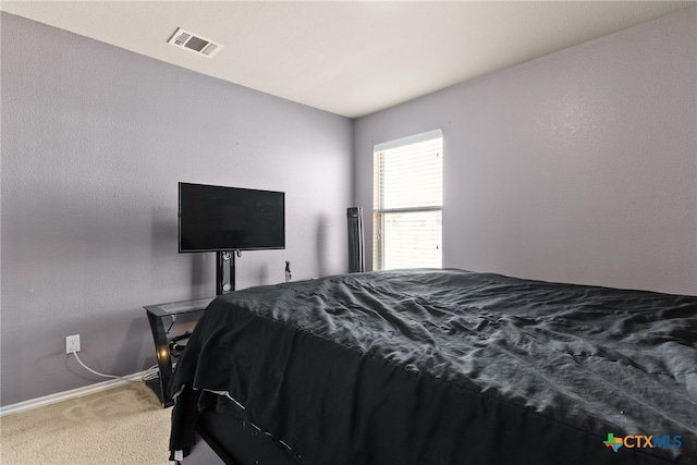 bedroom featuring carpet