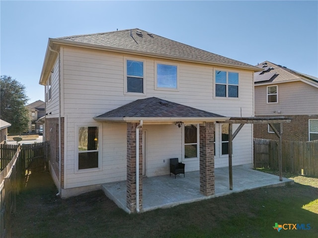 rear view of property featuring a patio area