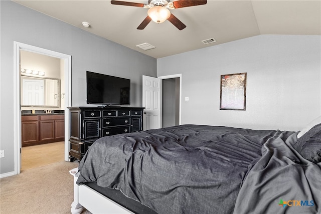 carpeted bedroom with ceiling fan, vaulted ceiling, and connected bathroom