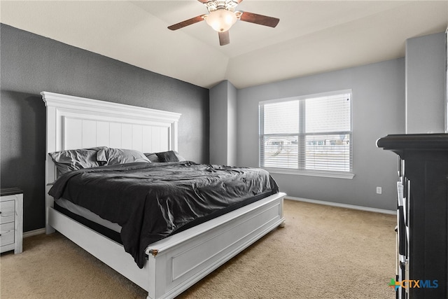 carpeted bedroom with ceiling fan and lofted ceiling