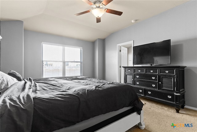 carpeted bedroom featuring vaulted ceiling and ceiling fan