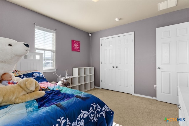 carpeted bedroom with a closet