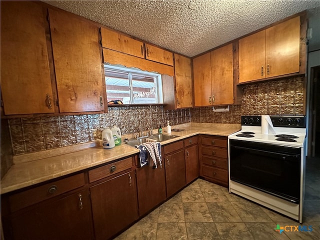 kitchen featuring a textured ceiling, backsplash, and white range with electric stovetop