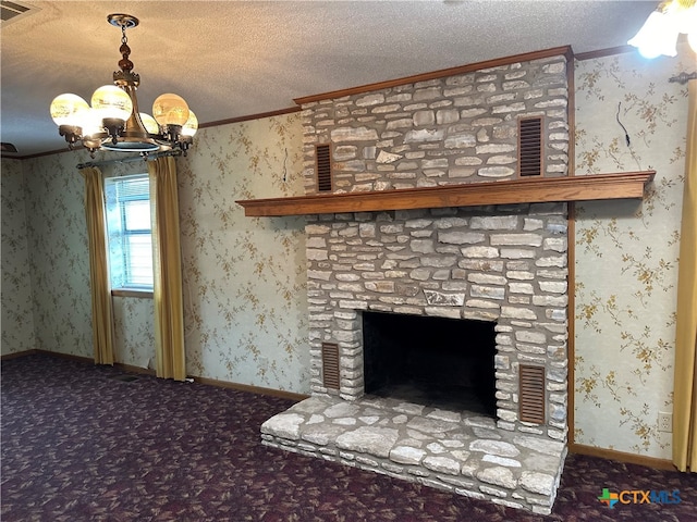 interior details featuring a fireplace, a chandelier, a textured ceiling, and crown molding