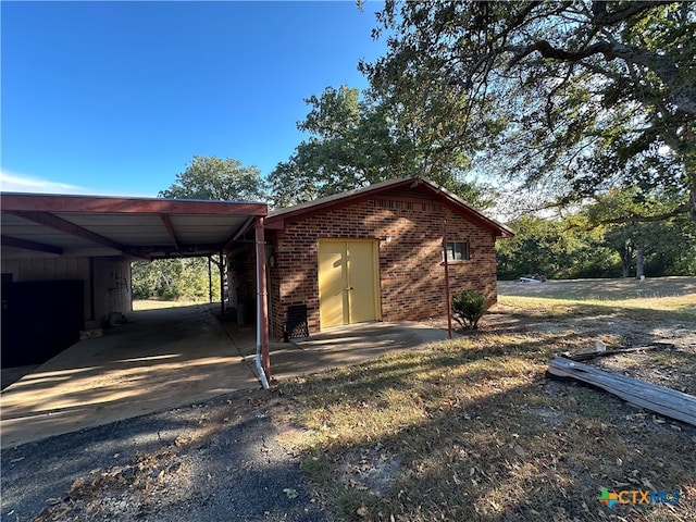 view of side of home featuring a carport