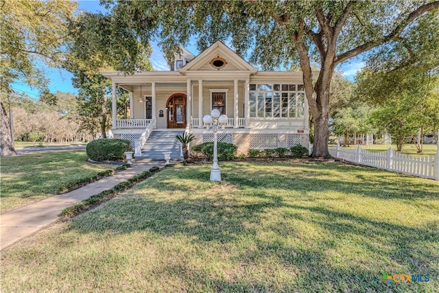 view of front of house featuring a front lawn and a porch