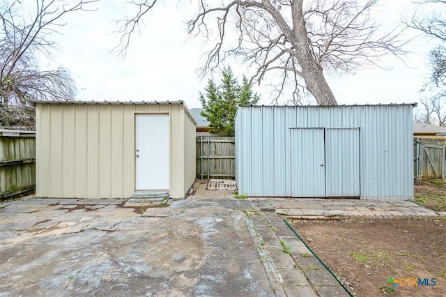 view of shed featuring a fenced backyard