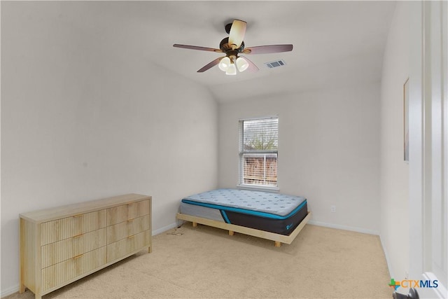 bedroom with lofted ceiling, light carpet, and ceiling fan