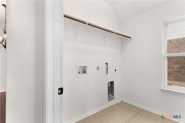 washroom with hookup for an electric dryer, light tile patterned floors, gas dryer hookup, laundry area, and washer hookup