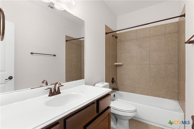 full bath featuring toilet, shower / bathtub combination, vanity, and tile patterned floors