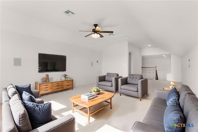 living room featuring arched walkways, visible vents, lofted ceiling, ceiling fan, and carpet floors