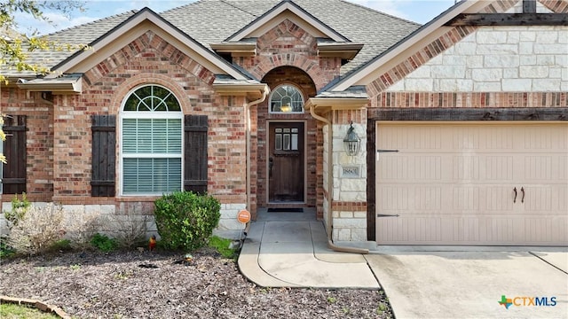 entrance to property featuring a garage