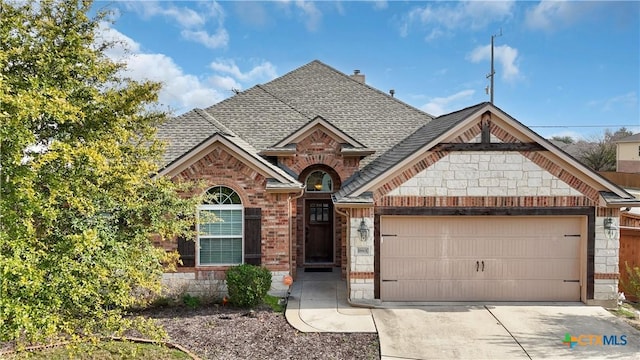 view of front of home featuring brick siding, an attached garage, and a shingled roof
