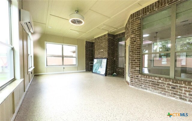 1403 Excel Dr, Killeen, TX 76542 - unfurnished sunroom with a wall mounted air conditioner