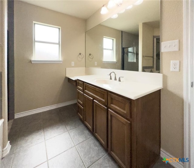 1403 Excel Dr, Killeen, TX 76542 - bathroom featuring vanity, tile patterned floors, and an enclosed shower