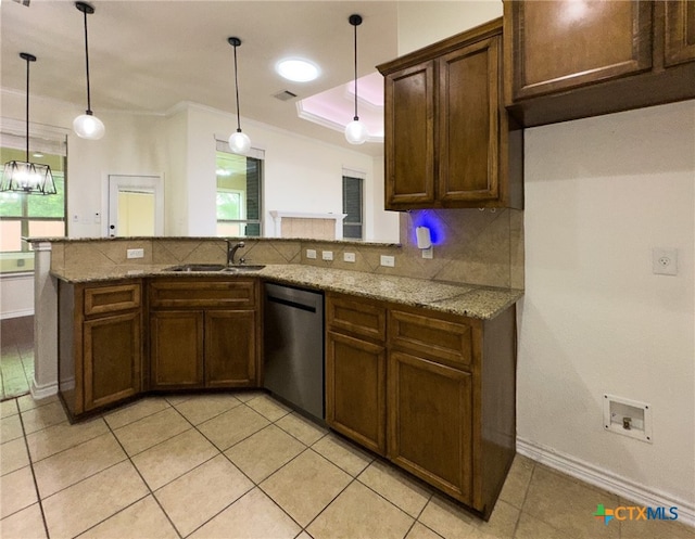 1403 Excel Dr, Killeen, TX 76542 - kitchen featuring stainless steel dishwasher, light tile patterned floors, a peninsula, light stone countertops, and pendant lighting