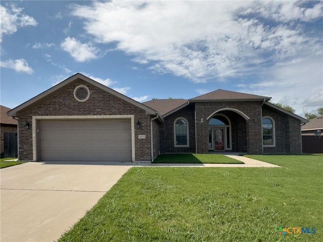 1403 Excel Dr, Killeen, TX 76542 - view of front of house featuring driveway, brick siding, and a garage