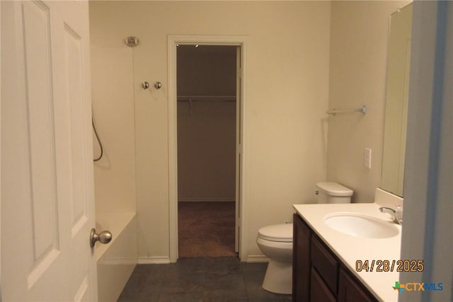 9202 Sage Valley Dr, Temple, TX 76502 - full bathroom featuring toilet, vanity, a walk in closet, and tile patterned floors