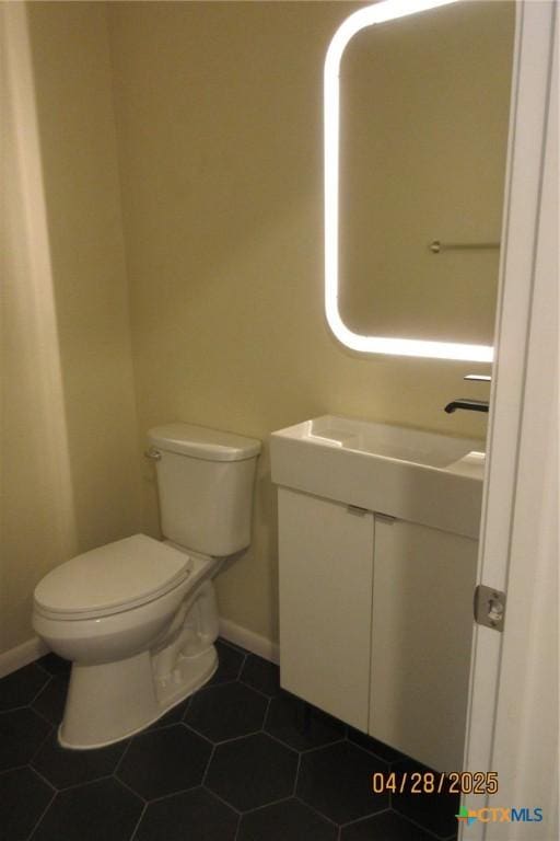 9202 Sage Valley Dr, Temple, TX 76502 - half bath with vanity, toilet, baseboards, and tile patterned flooring