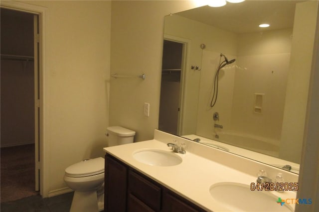 9202 Sage Valley Dr, Temple, TX 76502 - full bathroom featuring toilet, double vanity, a walk in closet, tub / shower combination, and tile patterned flooring