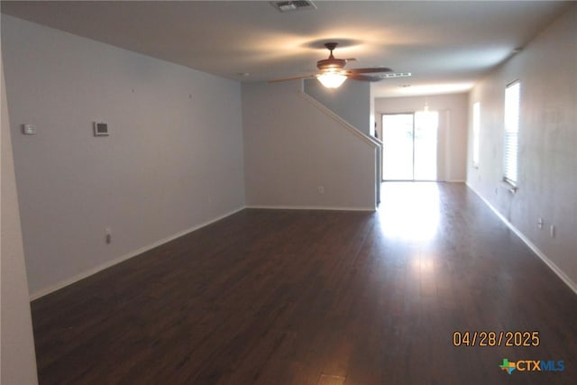 9202 Sage Valley Dr, Temple, TX 76502 - unfurnished living room with a ceiling fan, dark wood-style flooring, and baseboards