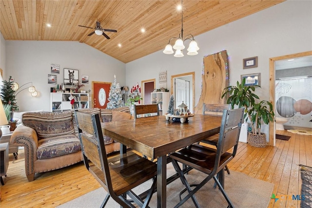 dining space featuring ceiling fan with notable chandelier, wood ceiling, high vaulted ceiling, and light hardwood / wood-style flooring