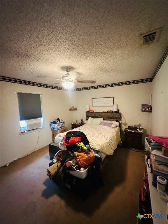 218 Monterrey Dr, Victoria, TX 77904 - carpeted bedroom with a textured ceiling, cooling unit, and a ceiling fan
