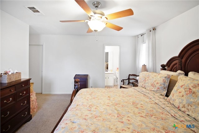 bedroom featuring ceiling fan, carpet, and connected bathroom