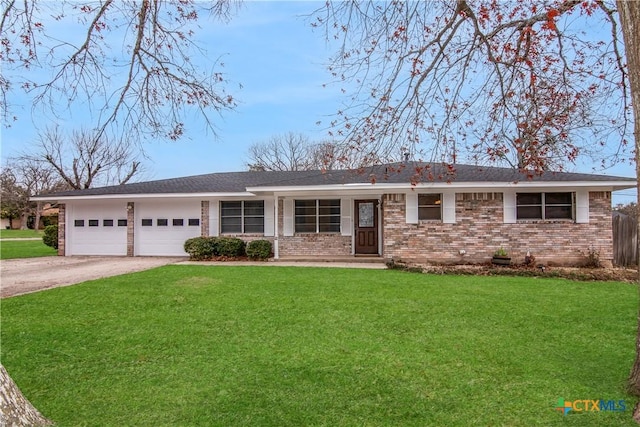 single story home featuring a garage and a front lawn