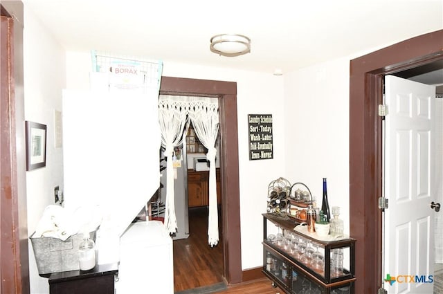 hall with wood finished floors