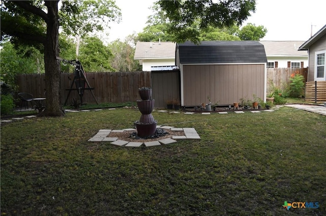 view of yard featuring a shed and an outbuilding