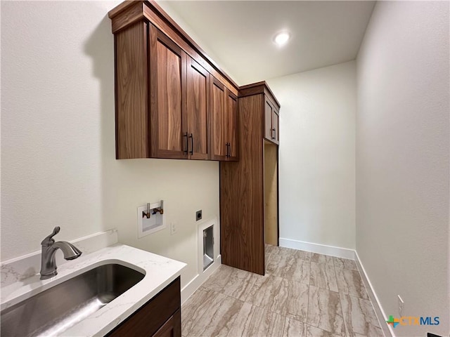 425 Dos Rios Dr, Belton, TX 76513 - laundry area featuring cabinet space, hookup for an electric dryer, hookup for a washing machine, light marble finish flooring, and baseboards