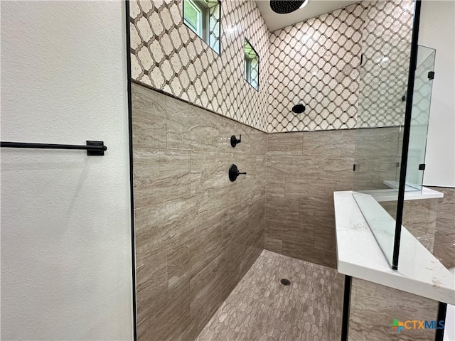 425 Dos Rios Dr, Belton, TX 76513 - bathroom with tiled shower and a textured wall