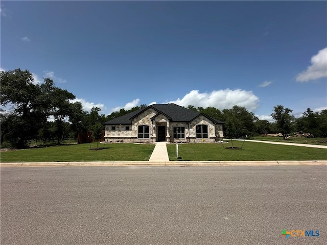 425 Dos Rios Dr, Belton, TX 76513 - french country style house with stone siding and a front yard