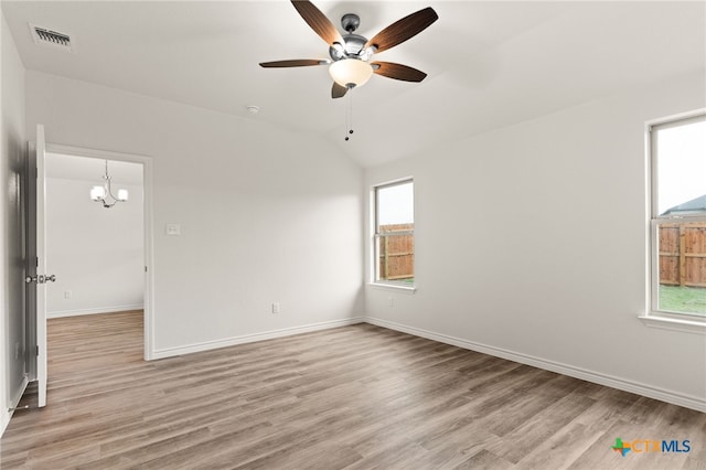 5113 Rose Petal Ct, Killeen, TX 76542 - unfurnished room with a ceiling fan, light wood-style floors, baseboards, lofted ceiling, and a chandelier