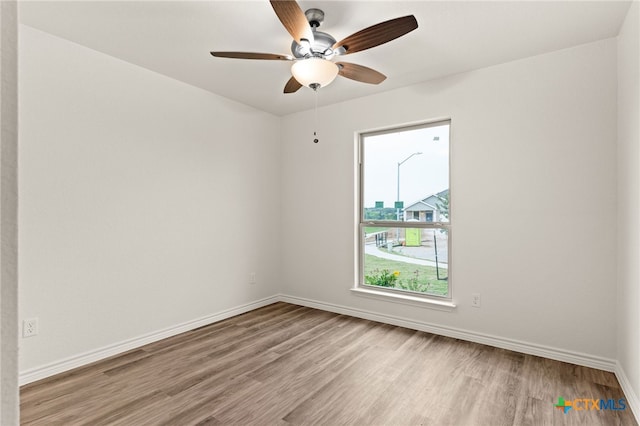 5113 Rose Petal Ct, Killeen, TX 76542 - spare room featuring wood finished floors, baseboards, and ceiling fan