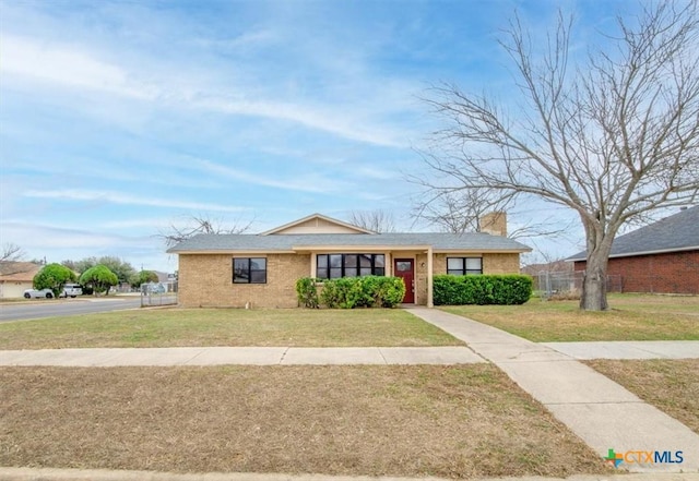 ranch-style house with a front lawn