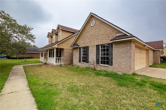 view of front of property with a porch, a garage, and a front yard