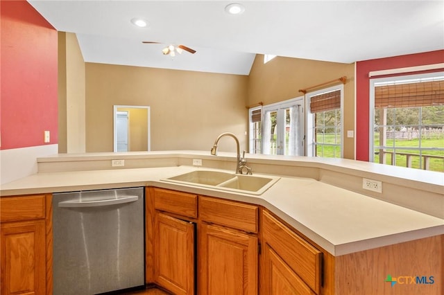 kitchen with dishwasher, plenty of natural light, sink, and kitchen peninsula