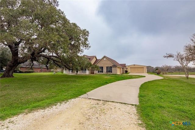 ranch-style home featuring a garage and a front lawn