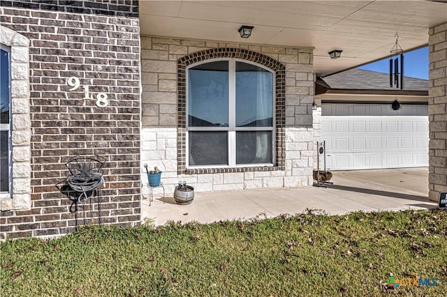 view of exterior entry featuring a garage