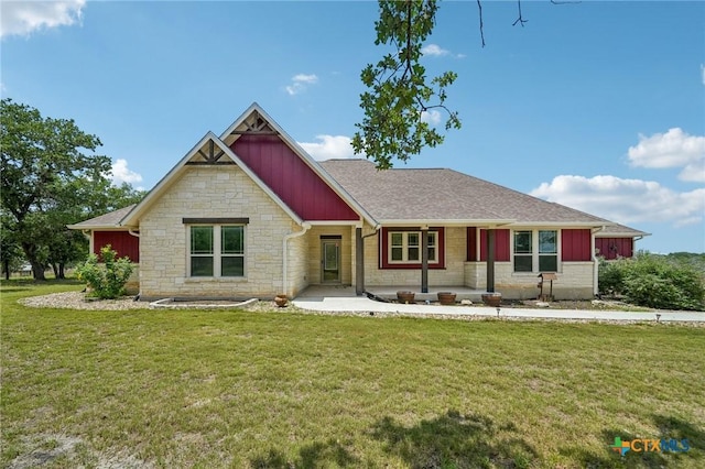 4049 Hickory Forrest Dr, Seguin, TX 78155 - view of front facade with stone siding, board and batten siding, and a front lawn