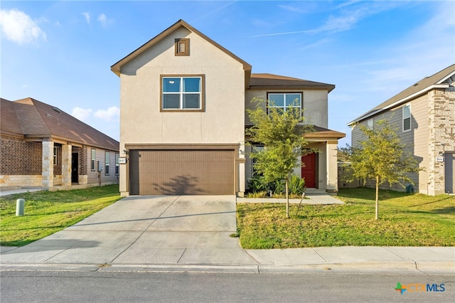 view of front property featuring a garage and a front lawn