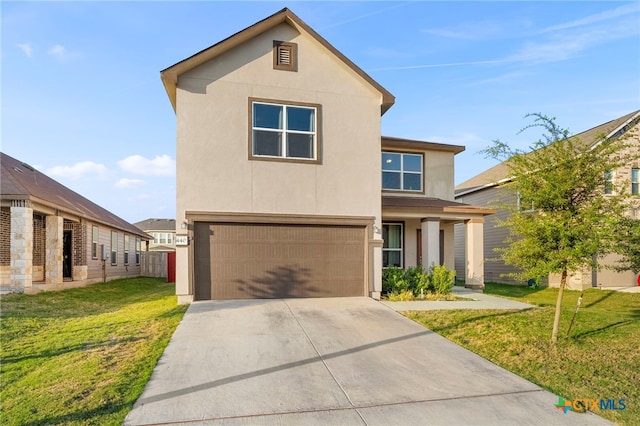 view of front of property featuring a garage and a front lawn