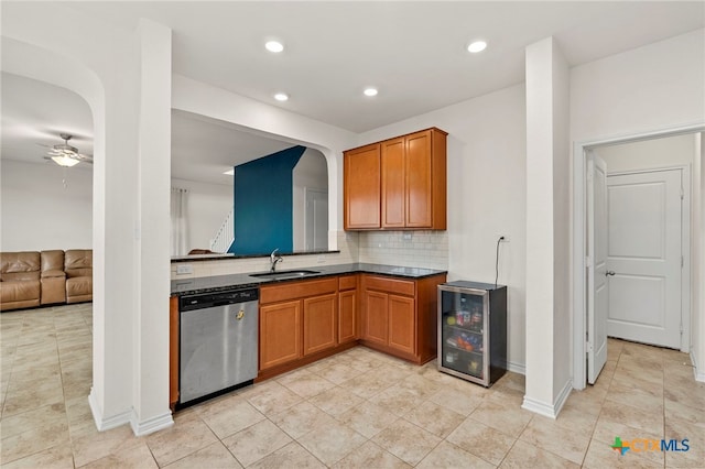 kitchen with tasteful backsplash, sink, dishwasher, beverage cooler, and ceiling fan