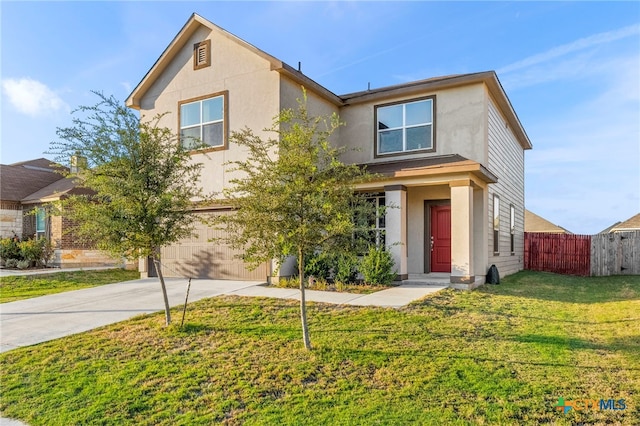 view of front of property featuring a garage and a front yard