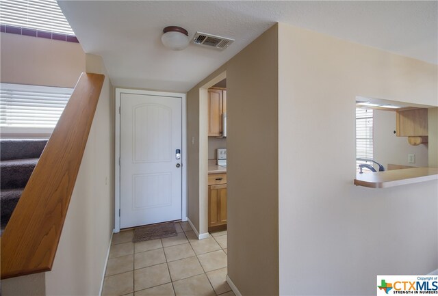 view of tiled foyer entrance